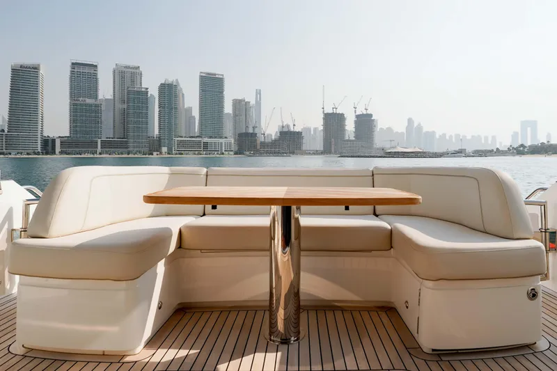 Princess F50 Model 2022 Yacht Photos Pics Luxurious seating area on 2022 Princess F50 yacht with city skyline view.