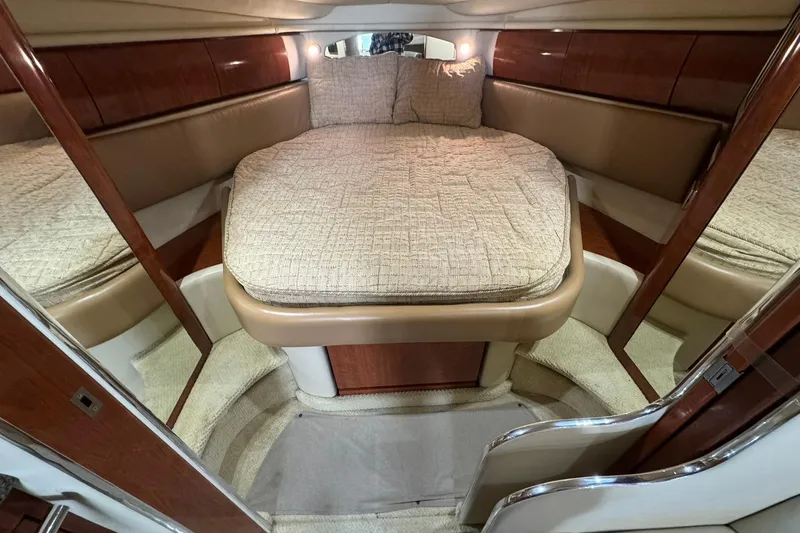 The Judy Len Yacht Photos Pics Luxurious cabin interior of 2005 Sea Ray 360 Sundancer yacht with cozy bed.