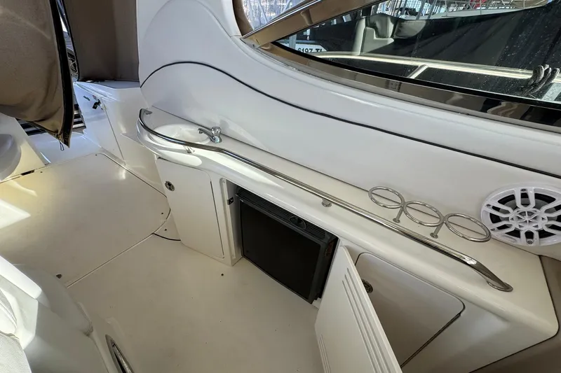 The Judy Len Yacht Photos Pics 2005 Sea Ray 360 Sundancer interior with open cabinet and speaker detail.