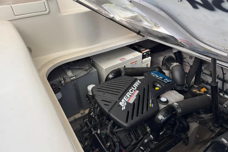 The Judy Len Yacht Photos Pics Engine compartment of 2005 Sea Ray 360 Sundancer with Mercury engine visible.