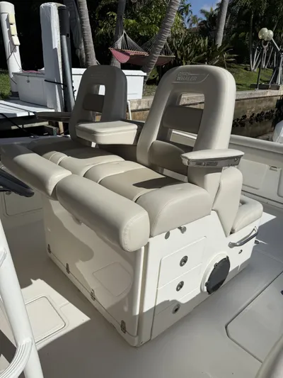  Yacht Photos Pics 2020 Boston Whaler 330 Outrage boat seating area with beige upholstery.