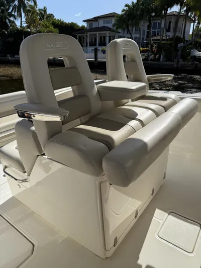  Yacht Photos Pics 2020 Boston Whaler 330 Outrage boat seating, featuring luxurious beige upholstery.