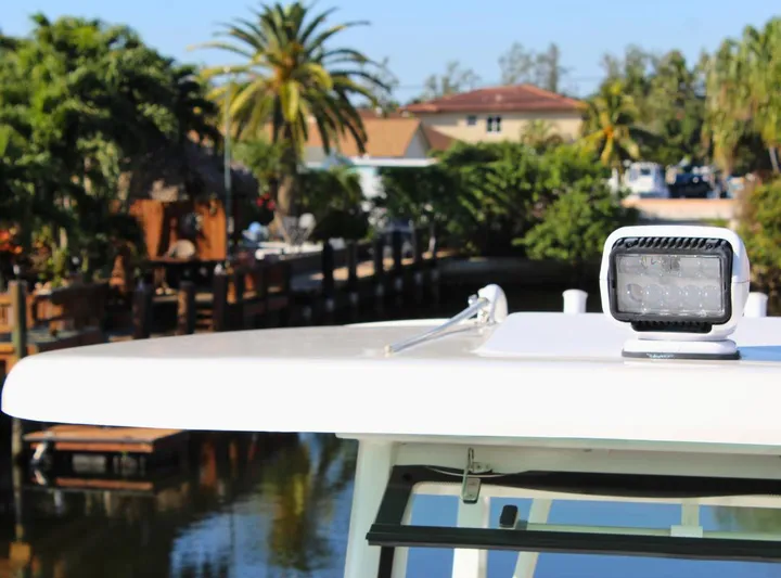  Yacht Photos Pics Robalo 272 boat roof with spotlight, tropical background, 2021 model.