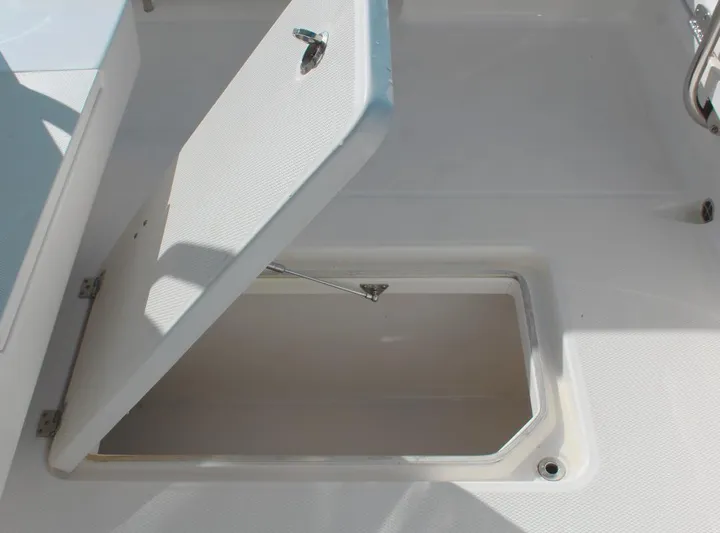  Yacht Photos Pics Open storage compartment on 2021 Robalo 272 boat deck.