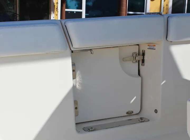  Yacht Photos Pics Robalo 272 boat interior detail, 2021 model, featuring a white storage compartment.