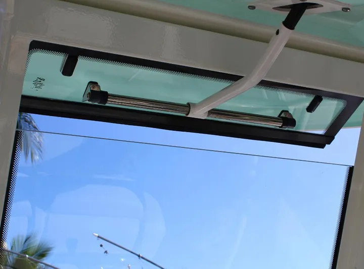  Yacht Photos Pics Robalo 272 boat window view, showcasing clear blue sky, 2021 model.