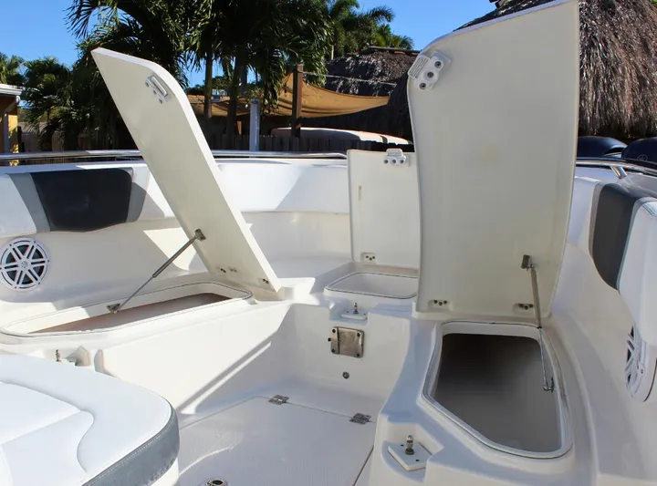  Yacht Photos Pics 2021 Robalo 272 boat interior with open storage compartments and seating.