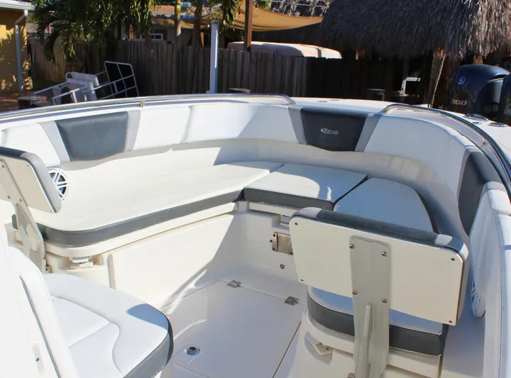  Yacht Photos Pics 2021 Robalo 272 boat interior with cushioned seating and sleek design.