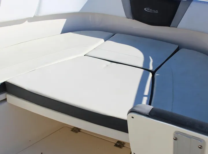  Yacht Photos Pics 2021 Robalo 272 boat interior seating with cushioned lounge area.