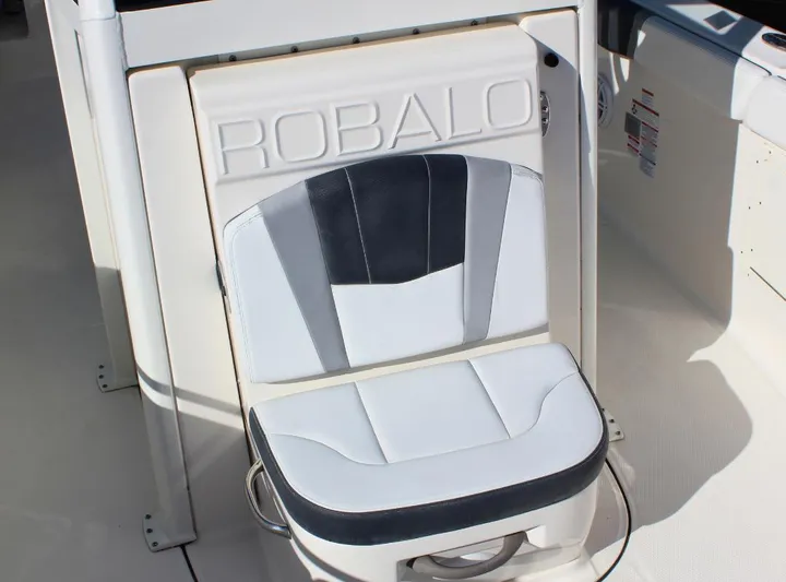  Yacht Photos Pics 2021 Robalo 272 boat seat with stylish black and white design.