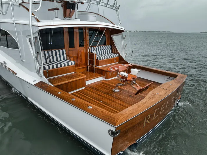  Yacht Photos Pics Luxurious 2011 Jim Smith Custom Sportfish yacht with elegant wood deck and striped seating.