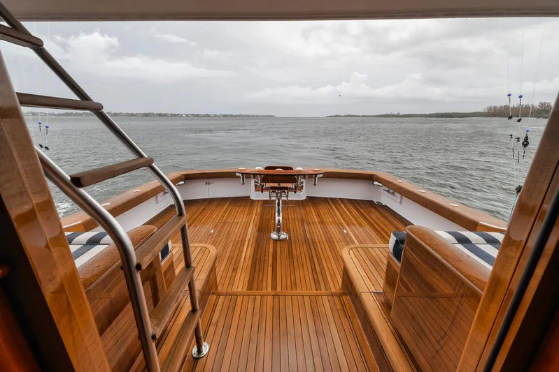  Yacht Photos Pics Luxurious 2011 Jim Smith Custom Sportfish yacht deck with wooden finish overlooking the ocean.