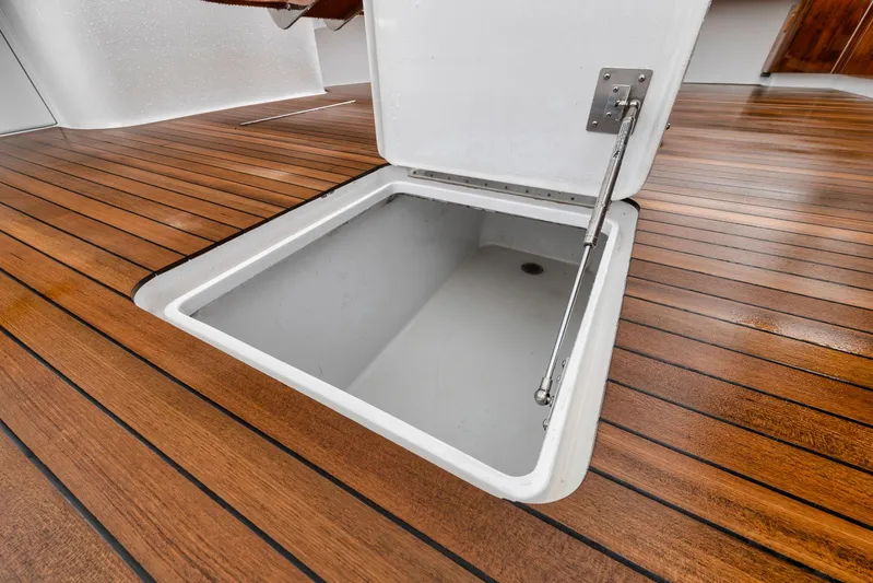  Yacht Photos Pics Open hatch on teak deck of 2011 Jim Smith Custom Sportfish boat.