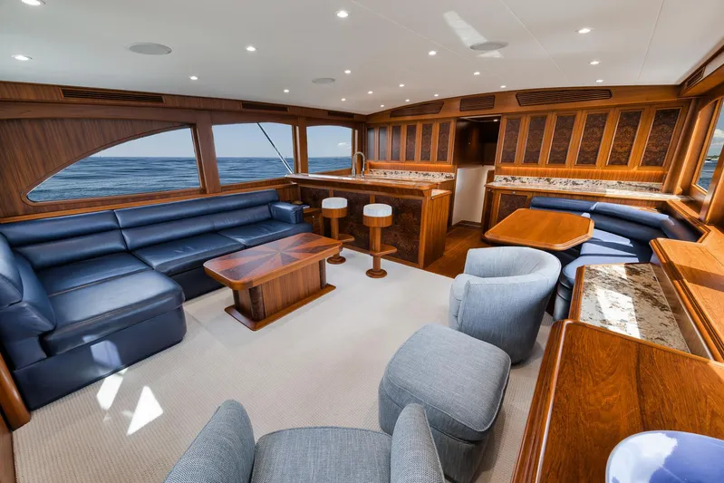 Yacht Photos Pics Luxurious interior of 2011 Jim Smith Custom Sportfish yacht with elegant seating and wood finishes.