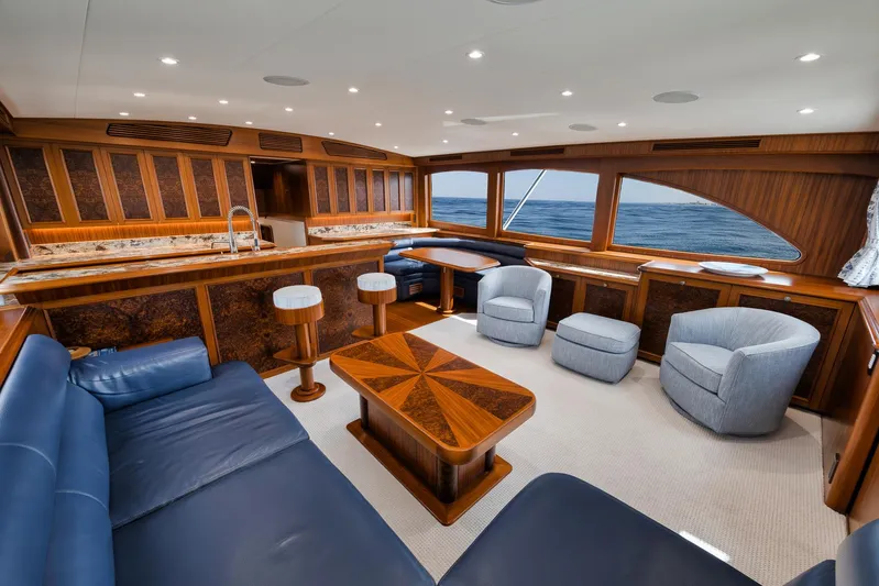  Yacht Photos Pics Luxurious interior of 2011 Jim Smith Custom Sportfish yacht with elegant wood finishes and ocean view.