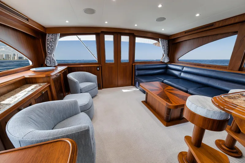  Yacht Photos Pics Luxurious interior of 2011 Jim Smith Custom Sportfish yacht with elegant wood and leather furnishings.