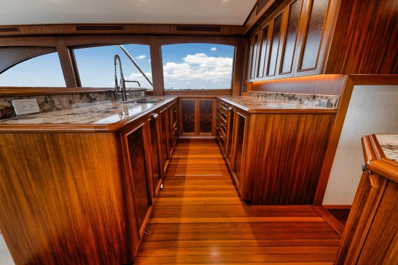  Yacht Photos Pics Luxurious wooden interior of 2011 Jim Smith Custom Sportfish yacht with marble countertops.