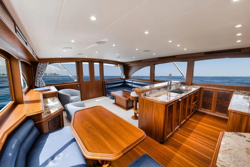  Yacht Photos Pics Luxurious interior of 2011 Jim Smith Custom Sportfish yacht with elegant wood finishes and ocean view.