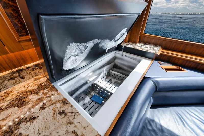  Yacht Photos Pics Open freezer on 2011 Jim Smith Custom Sportfish yacht with luxurious interior and ocean view.