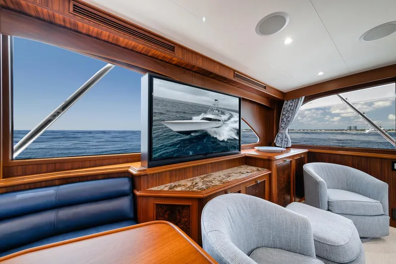  Yacht Photos Pics Luxurious interior of 2011 Jim Smith Custom Sportfish yacht with ocean view and elegant seating.