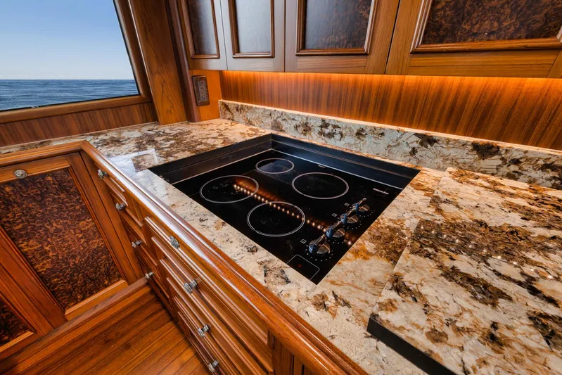  Yacht Photos Pics Luxurious kitchen on 2011 Jim Smith Custom Sportfish yacht with marble countertops and ocean view.