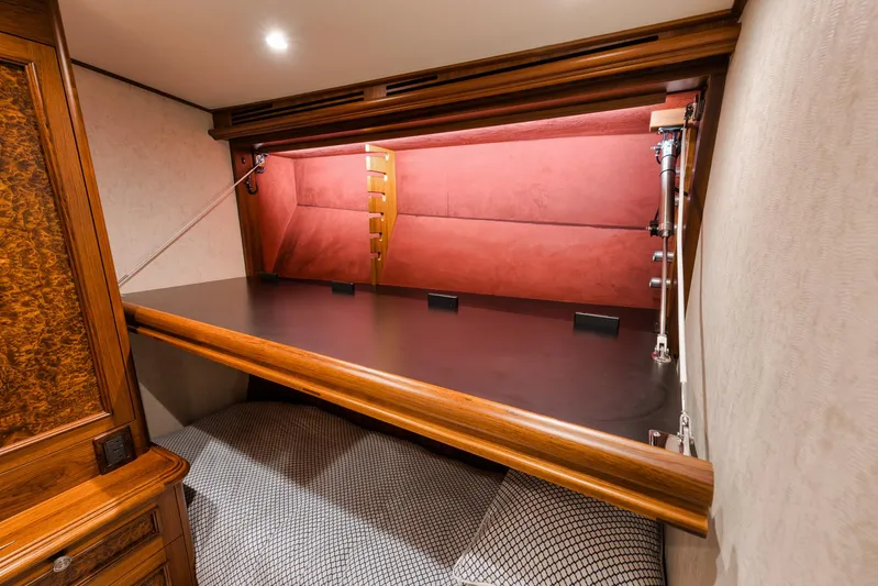  Yacht Photos Pics Luxurious interior of 2011 Jim Smith Custom Sportfish with elegant wood and upholstered details.