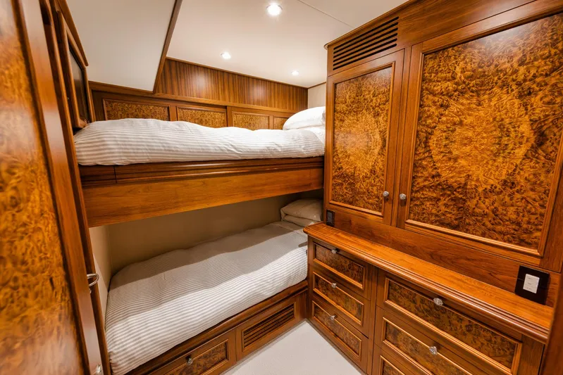  Yacht Photos Pics Luxurious wooden cabin interior with bunk beds on a 2011 Jim Smith Custom Sportfish yacht.