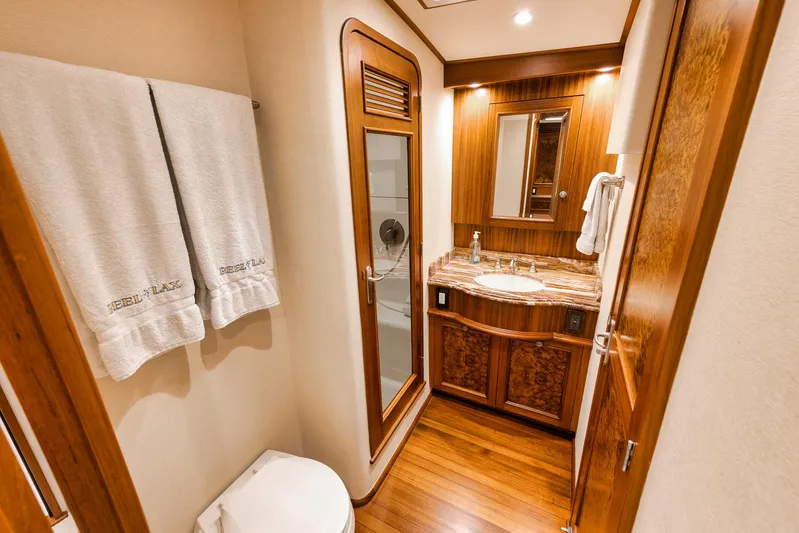  Yacht Photos Pics Luxurious bathroom in 2011 Jim Smith Custom Sportfish yacht with wooden accents and modern fixtures.