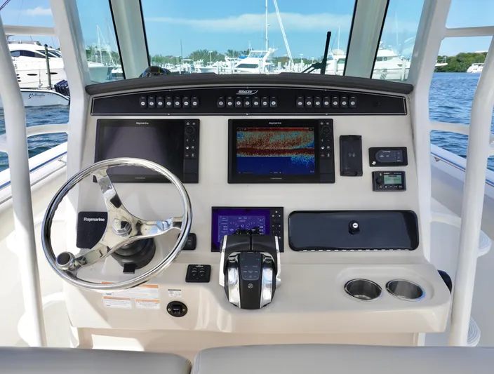  Yacht Photos Pics 2021 Boston Whaler 330 Outrage helm with advanced navigation and control systems.
