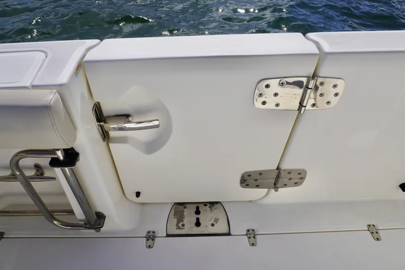  Yacht Photos Pics Boston Whaler 330 Outrage 2021 boat door with stainless steel hinges and handle.