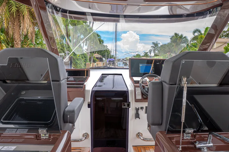  Yacht Photos Pics 2024 Fjord 41 XP yacht cockpit with modern controls and tropical backdrop.