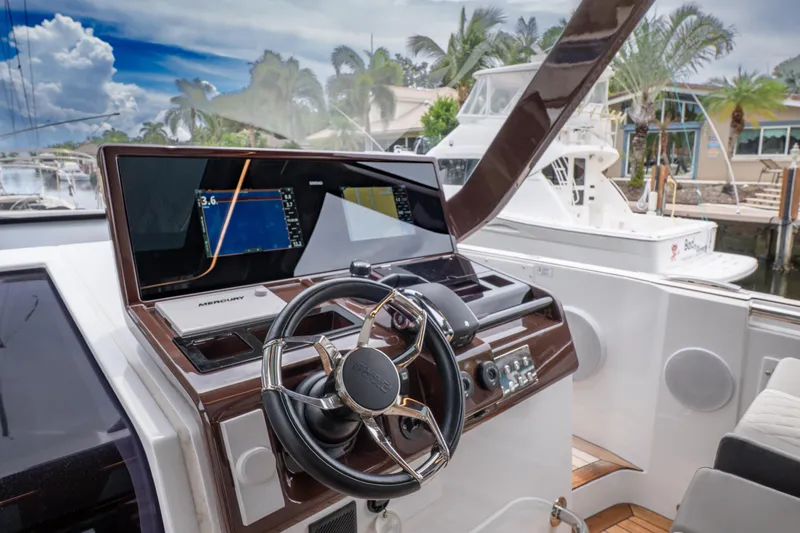  Yacht Photos Pics 2024 Fjord 41 XP yacht helm with modern navigation system and luxurious design.