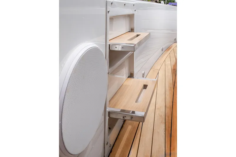  Yacht Photos Pics 2024 Fjord 41 XP yacht with wooden deck and built-in storage shelves.