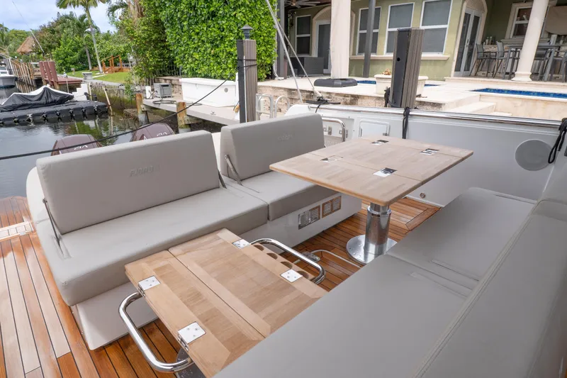  Yacht Photos Pics Luxurious 2024 Fjord 41 XP yacht interior with elegant seating and wooden tables.