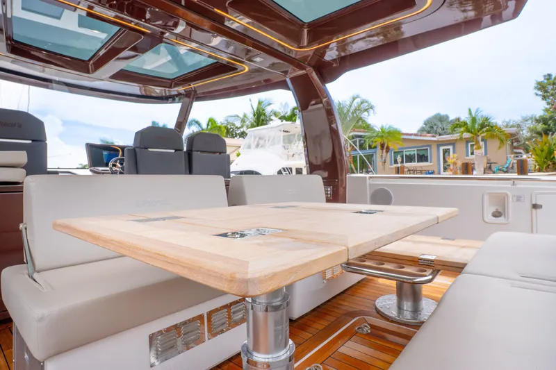  Yacht Photos Pics Luxurious interior of 2024 Fjord 41 XP yacht with elegant seating and wooden table.