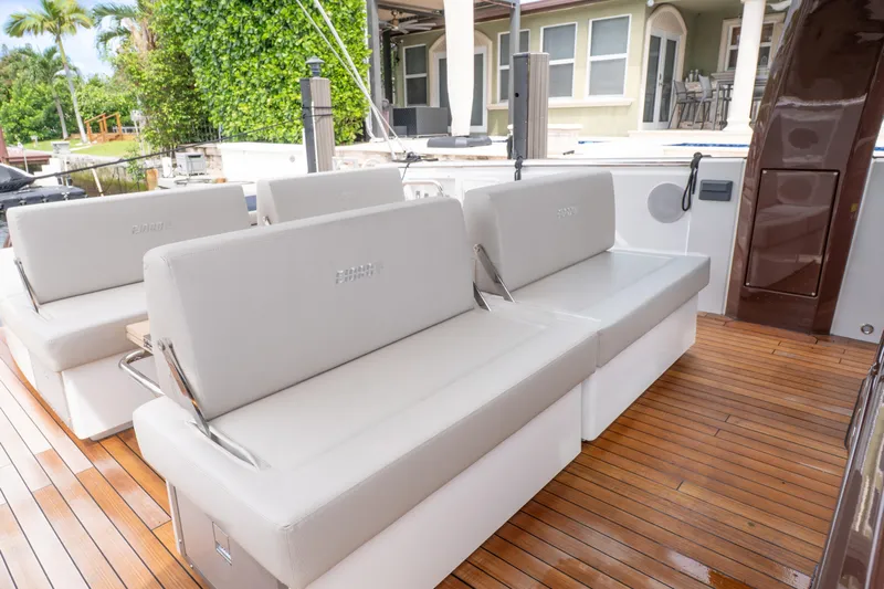  Yacht Photos Pics Luxurious seating on 2024 Fjord 41 XP yacht with sleek wooden deck.