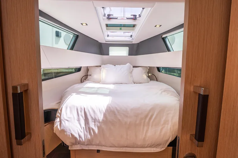  Yacht Photos Pics Luxurious cabin interior of 2024 Fjord 41 XP yacht with cozy bed and modern design.