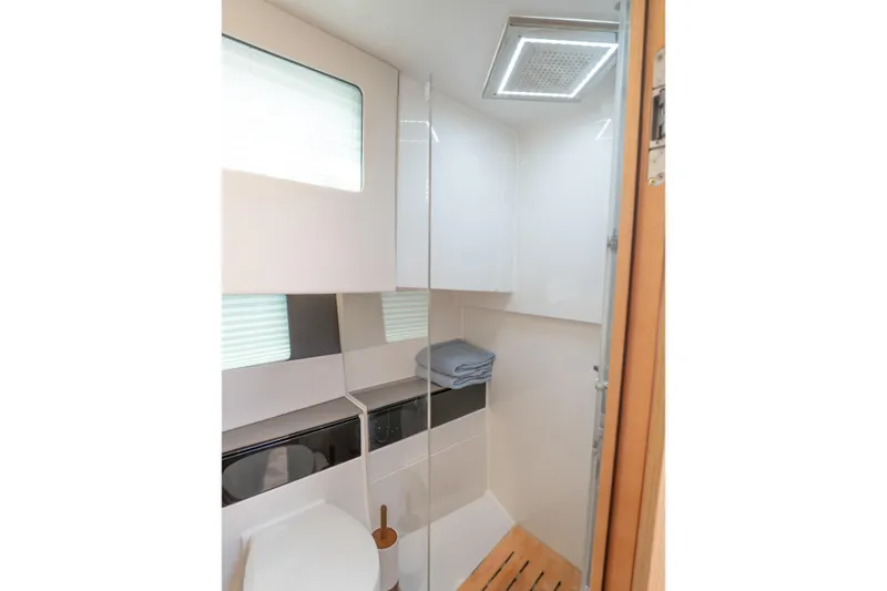  Yacht Photos Pics Modern bathroom interior of 2024 Fjord 41 XP yacht with sleek design and natural lighting.