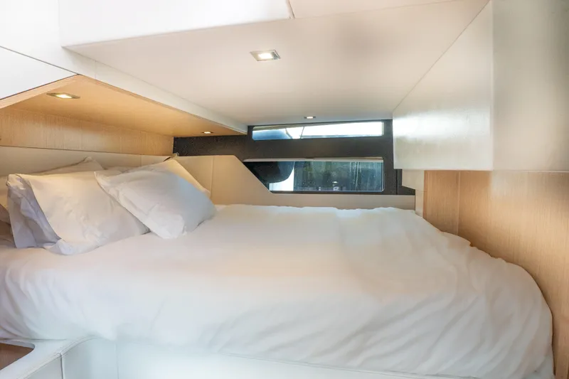  Yacht Photos Pics Luxurious cabin interior of 2024 Fjord 41 XP yacht with cozy bedding.