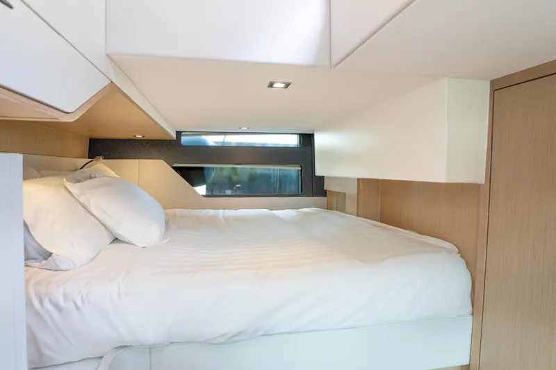  Yacht Photos Pics Luxurious cabin interior of 2024 Fjord 41 XP yacht with modern bedding.