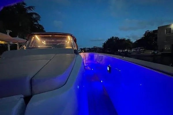  Yacht Photos Pics 2024 Fjord 41 XP yacht with blue LED lights at dusk.