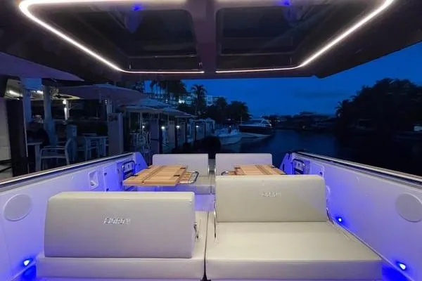  Yacht Photos Pics 2024 Fjord 41 XP luxury yacht interior with ambient blue lighting at dusk.
