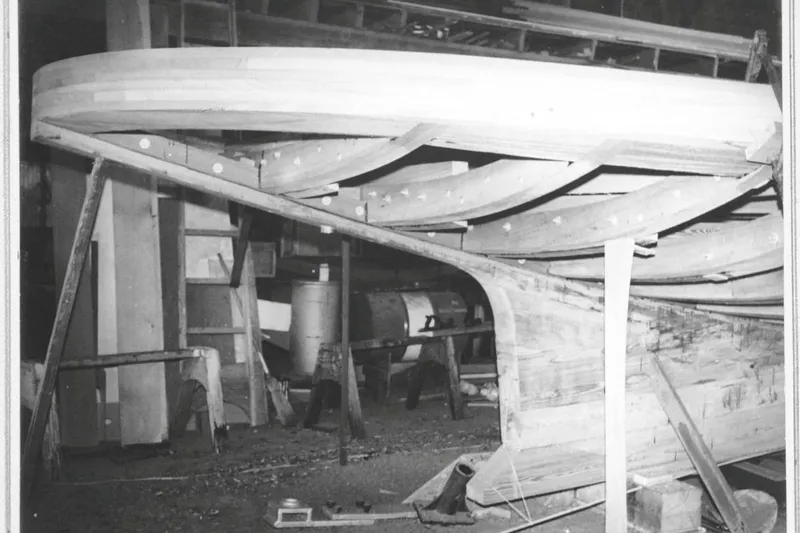 Clark Mills Yacht Photos Pics Wooden frame of a 1972 custom tug boat under construction in a workshop.