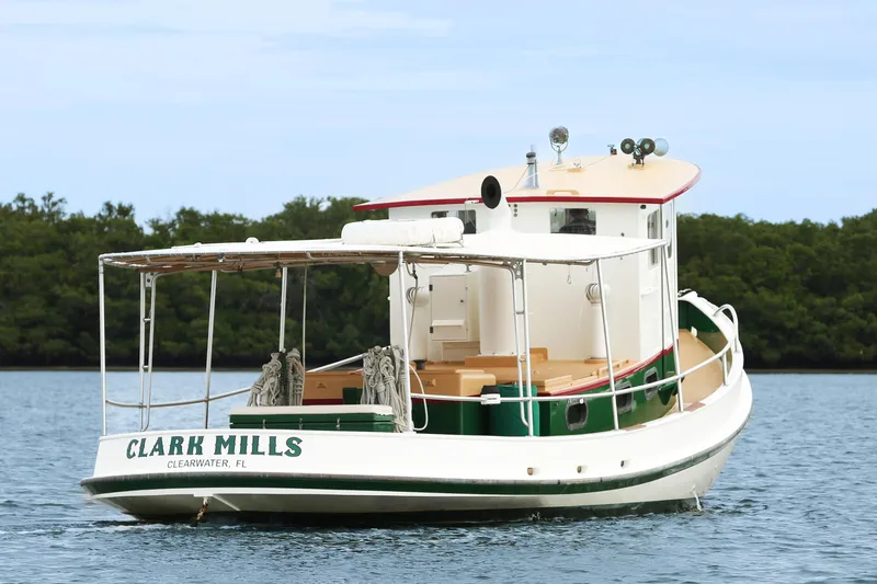 Clark Mills Yacht Photos Pics 1972 Mills Boat Works tug boat on calm water, Clearwater, Florida.