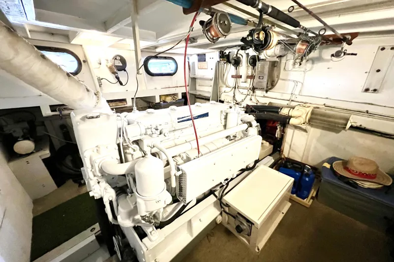 Clark Mills Yacht Photos Pics Engine room of a 1972 Mills Boat Works Tug Boat, showcasing machinery and equipment.