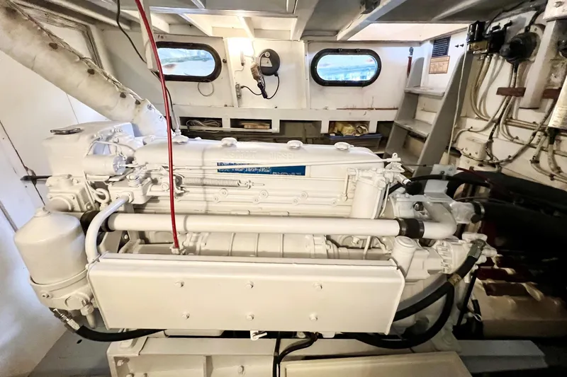 Clark Mills Yacht Photos Pics 1972 Mills Boat Works Tug Boat engine room with visible machinery and portholes.