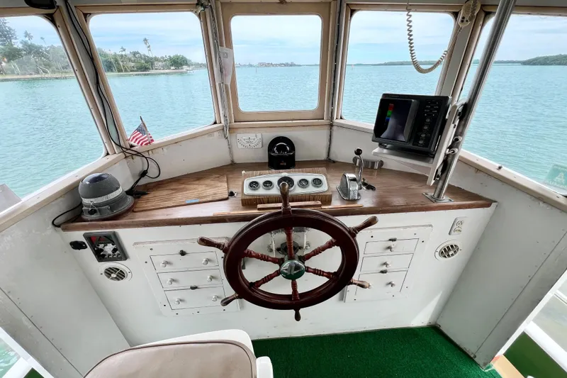 Clark Mills Yacht Photos Pics 1972 Mills Boat Works Tug Boat helm with wooden wheel and navigation equipment.