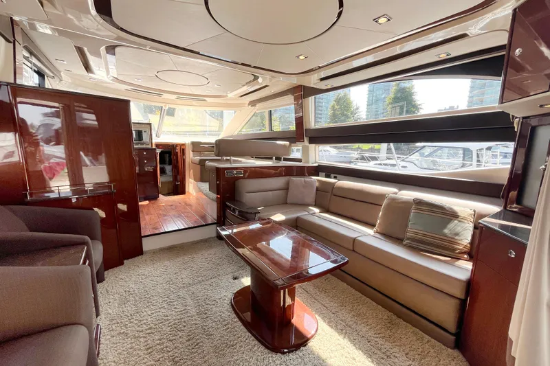  Yacht Photos Pics Luxurious interior of a 2012 Meridian 441 Sedan yacht with plush seating and elegant wood finishes.