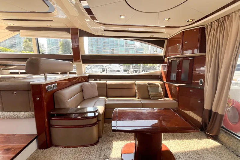  Yacht Photos Pics Luxurious interior of a 2012 Meridian 441 Sedan yacht with elegant seating and wood finishes.