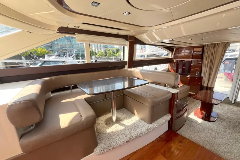  Yacht Photos Pics Luxurious interior of a 2012 Meridian 441 Sedan yacht with plush seating and elegant table.